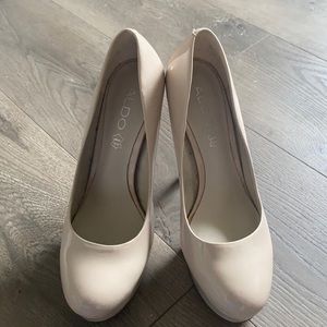 Nude aldo pumps in size 8.